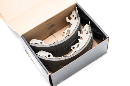 New car's break shoes kit in the box on the white backgroundの写真素材