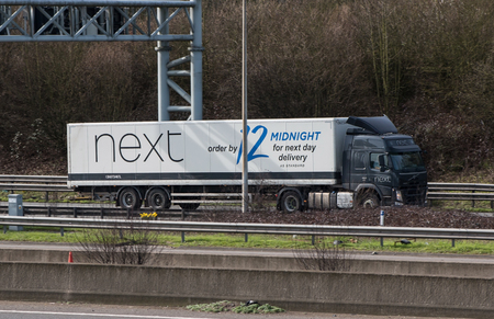 Watford, UK - March 13, 2017: Lorry belongs to the British store NEXT, in motion on the motorway M1のeditorial素材