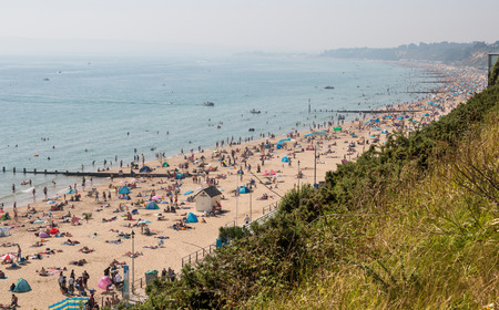 Bournemouth, UK - August 28, 2017: Busy beach in a hot summer day. View from the top of the cliffsのeditorial素材