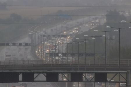 Redbourn, UK - September 21, 2017: Traffic on busy British motorway M1 in a bad rainy weather.のeditorial素材