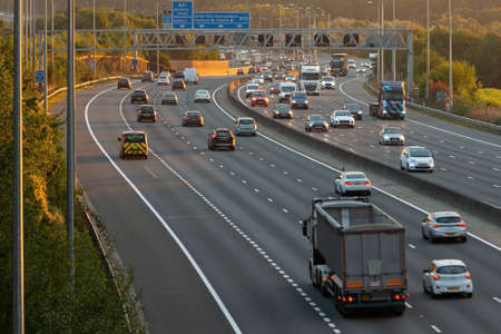 London, UK - September 20, 2021: British road transport. Evening traffic on busiest British motorway M25のeditorial素材