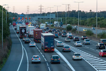 Watford, UK - September 23, 2021: British road transport. Afternoon traffic jam on British motorway M1.M25M1 junction.のeditorial素材