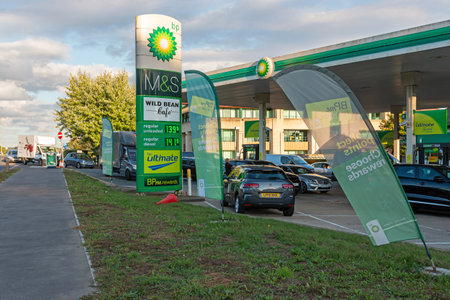 Hemel Hempstead, UK - September 27, 2021: Due to national shortage of lorry drivers and panic buy many petrol stations across UK run out fuel. BP petrol station with long queue of awaiting cars.のeditorial素材