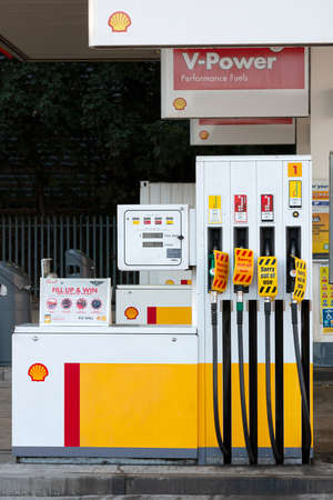 Hemel Hempstead, UK - September 27, 2021: Due to national shortage of lorry drivers and panic buy many petrol stations across UK run out fuel. Empty Shell petrol station with pumps out of fuel.のeditorial素材