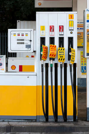 Hemel Hempstead, UK - September 27, 2021: Due to national shortage of lorry drivers and panic buy many petrol stations across UK run out fuel. Empty Shell petrol station with pumps out of fuel.のeditorial素材