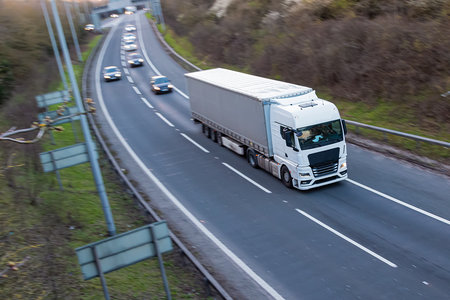 White lorry travelling on the motorway.の写真素材