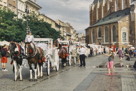 white cabs for transporting tourists in Cracowのeditorial素材