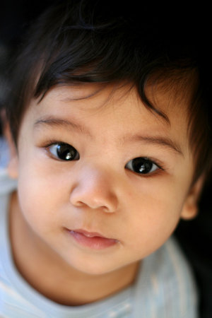 Quiet baby boy enjoying play timeの写真素材