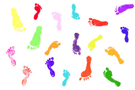 Colorful silhouette outlines of actual children's footprints on whiteの写真素材