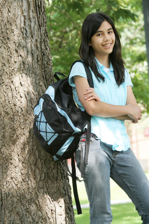 Teenager ready for school, standing with backpack.