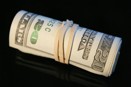 Small roll of twenty dollar billsの写真素材