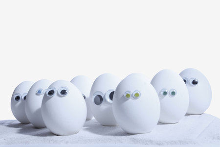 Eggs with eyeballs, lined up in row, Egg people. Add your own expressionsの写真素材