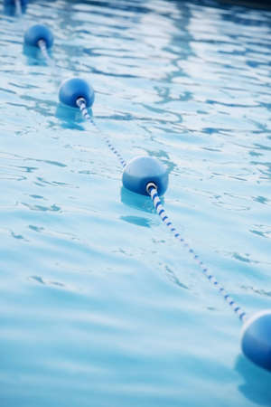 Blue water bouys in pool, shallow depth of fieldの写真素材