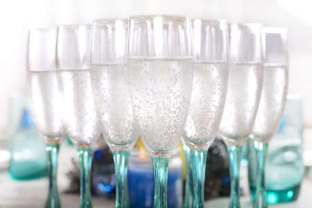 Flute wine glasses with drinkの写真素材