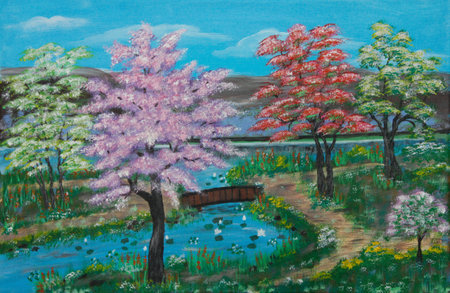Flowering Trees along the River at Springtime with mountains in backgroundの写真素材