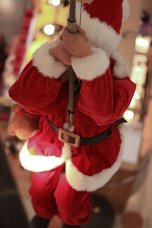 santa claus climbing the poleの写真素材