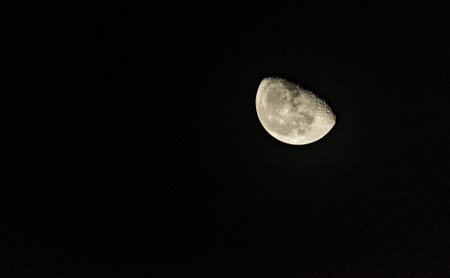View of the Moon half full and its cratersの写真素材