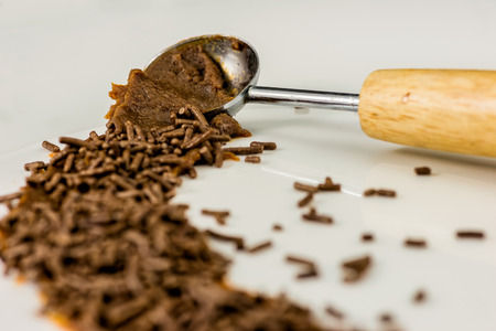Bitten Chocolate Brazilian Brigadeiro and a spoonの写真素材