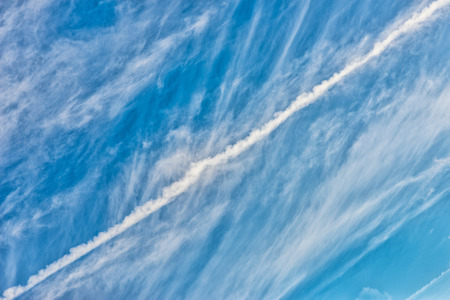 White clouds by a blue winter skyの写真素材