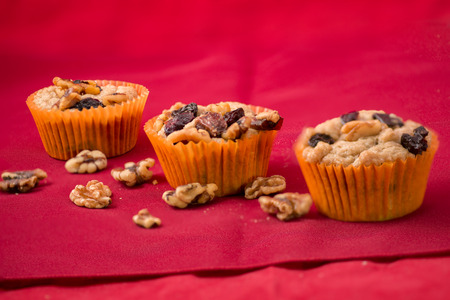 Christmas Nuts and Raisins Muffins on a placematの写真素材