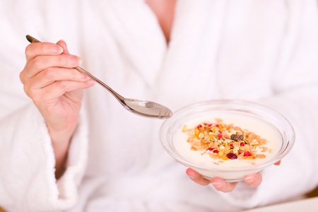 Woman eat healthy yugurt in the morning.の写真素材