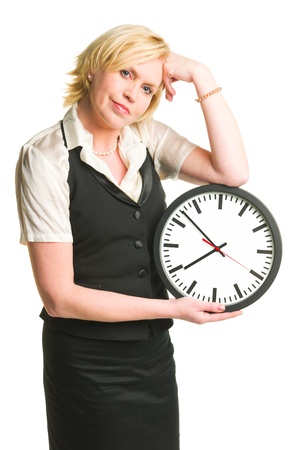 Woman holding and showing a clock, white isolated background.の写真素材