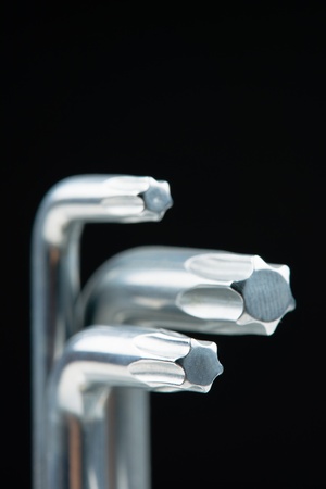 Several different size of Torx keys and black background の写真素材