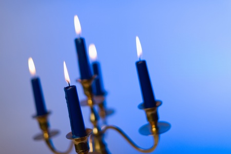 Little heat to the cold atmosphere, five candles and the brass candlestick.の写真素材