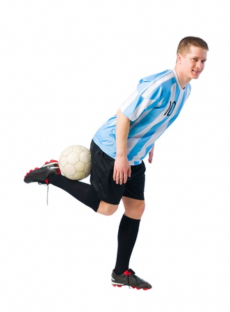 Soccer player control a ball, white  background の写真素材