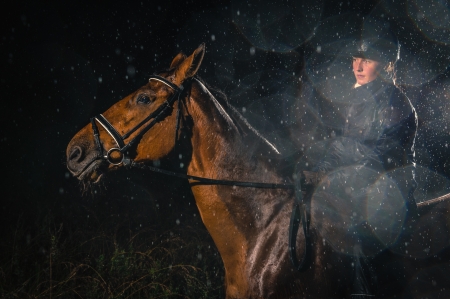 Woman rides in the rain, horizon formatの写真素材