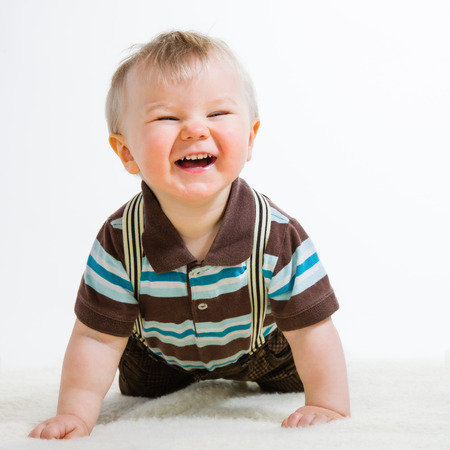 Baby boy, 16 Months old wearing striped shirt and suspendersの写真素材