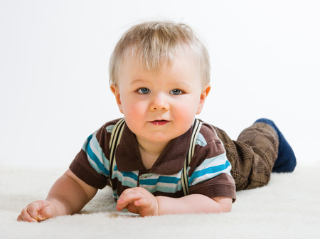 Baby boy, 16 Months old wearing striped shirt and suspendersの写真素材
