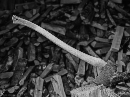 An axe and the woodpile, black and white imageの写真素材