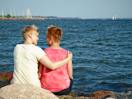 Women couple spend time together at the beach in the afternoonの写真素材