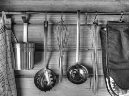 The kitchenware hanging on the wall, black and white imageの写真素材