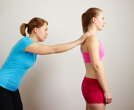 Osteopathy treatment, the professional masseuse and her patientの写真素材