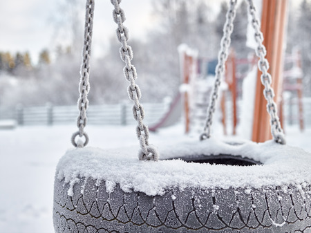 Close up, snowy playground in December, frost and cold weatherの写真素材