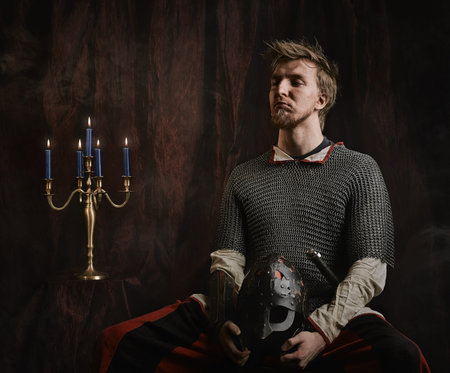 Portrait of medieval knight and he wearing a chainmail