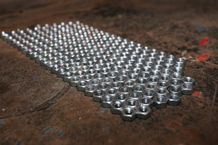 Nuts, bolts, wrenches on the old table metalの写真素材