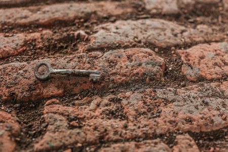 old rusty key , amid the ruined walls
