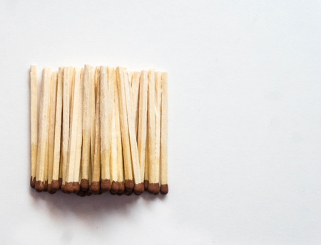 wooden matches close up on white background for design with place for your textの写真素材