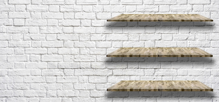 white brick wall with Wooden light shelf, can be used for object placementの写真素材