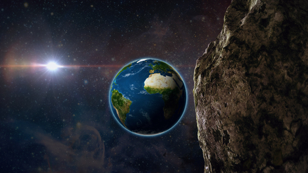 asteroid or meteor flies through space to earthの写真素材