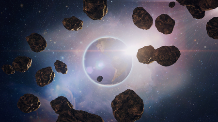 flight through the asteroids in space, the planet Saturn, with its bright glareの写真素材