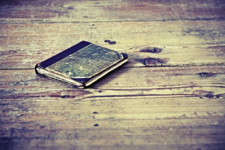 Beautiful old book on the wooden floorの写真素材