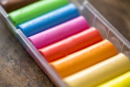 colors of plasticine on the wooden tableの写真素材