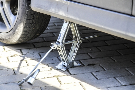 Changing tires or wheel before winter or springの写真素材