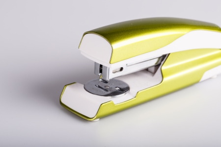 Light green stapler isolated on white の写真素材