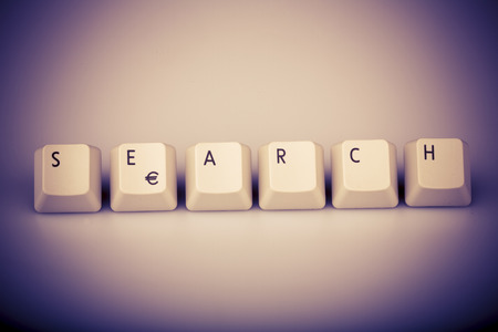 Word search formed with computer keyboard keys on white background with shadowの写真素材