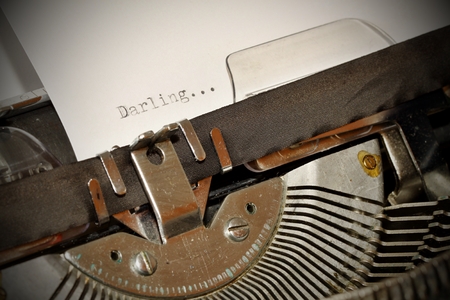 Darling word on white paper typed on old black typewriterの写真素材